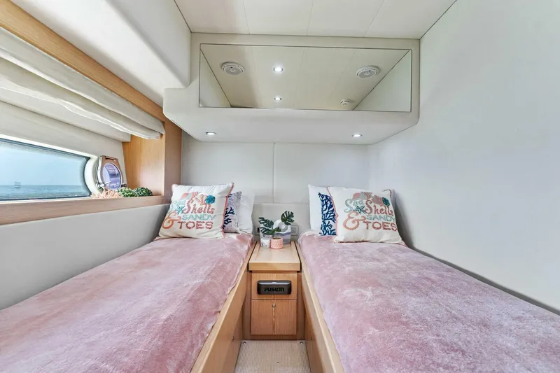 Big Deck Energy Yacht Photos Pics Luxurious twin cabin in 2013 Ferretti Yachts 620 with plush bedding and modern decor.