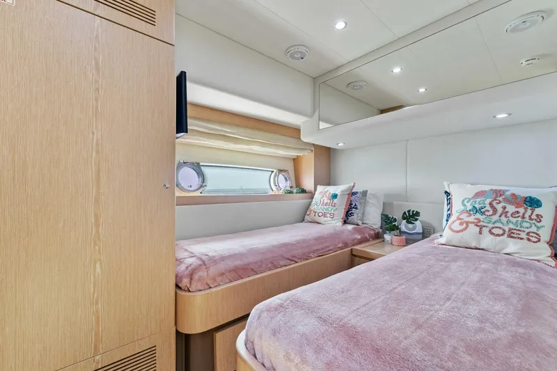 Big Deck Energy Yacht Photos Pics Luxurious twin cabin interior of 2013 Ferretti Yachts 620 with plush bedding and porthole view.