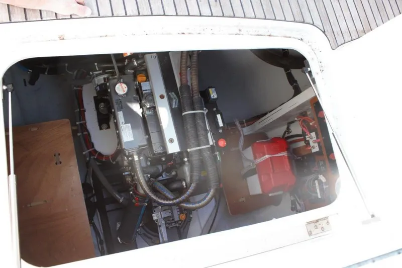 Jungle Goddess Yacht Photos Pics Engine compartment of a 2022 Lagoon 46 catamaran, showcasing mechanical components and wiring.