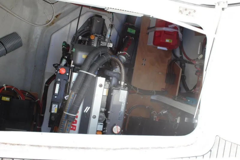 Jungle Goddess Yacht Photos Pics Engine compartment of a 2022 Lagoon 46 catamaran, showcasing mechanical components and wiring.