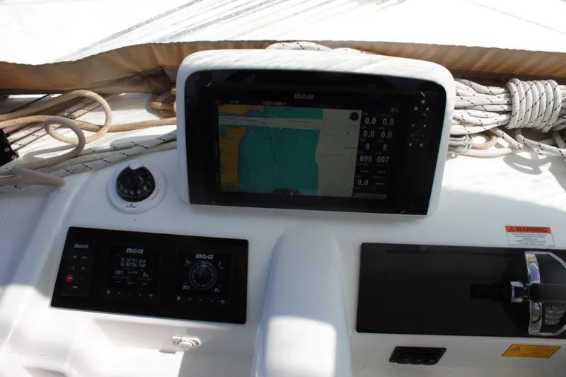Jungle Goddess Yacht Photos Pics Control panel of a 2022 Lagoon 46 yacht with navigation display and instruments.