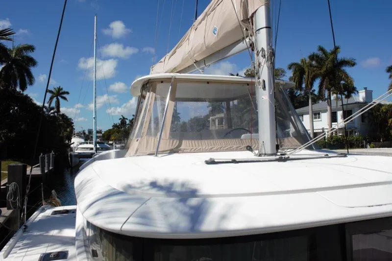 Jungle Goddess Yacht Photos Pics 2022 Lagoon 46 catamaran docked, featuring sleek design and tropical surroundings.