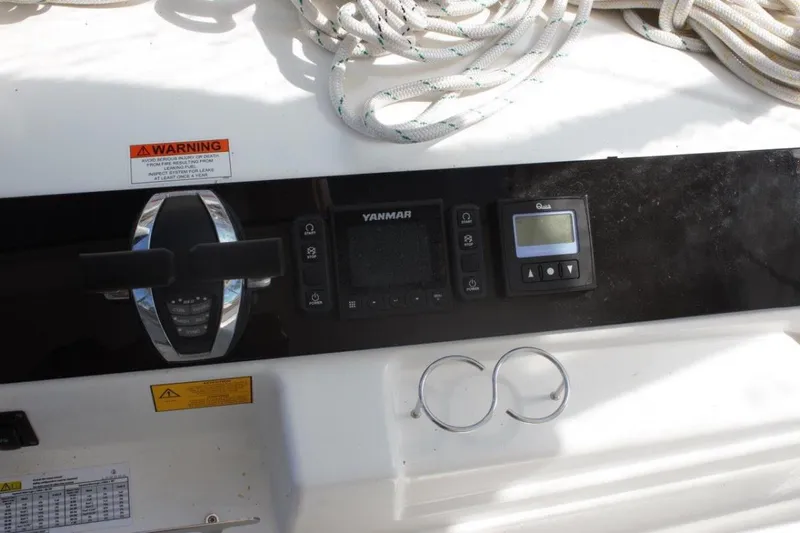 Jungle Goddess Yacht Photos Pics Control panel of a 2022 Lagoon 46 yacht with Yanmar display and ropes.