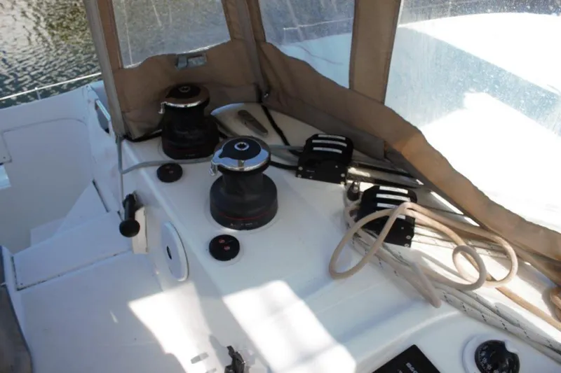 Jungle Goddess Yacht Photos Pics 2022 Lagoon 46 yacht deck with winches and ropes, under a protective canopy.