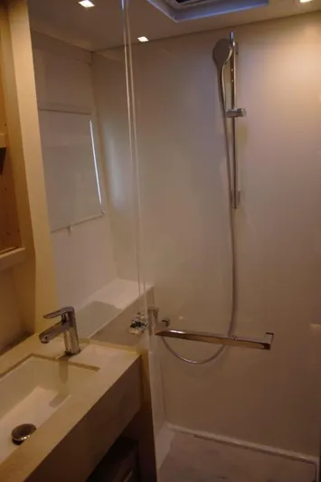 Jungle Goddess Yacht Photos Pics 2022 Lagoon 46 yacht bathroom with modern shower and sink.