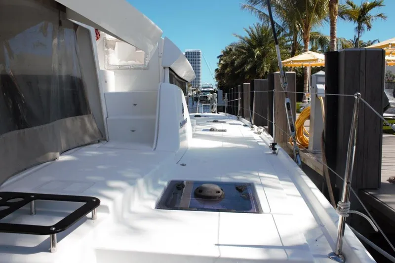 Jungle Goddess Yacht Photos Pics 2022 Lagoon 46 yacht docked, showcasing sleek deck design and modern features.