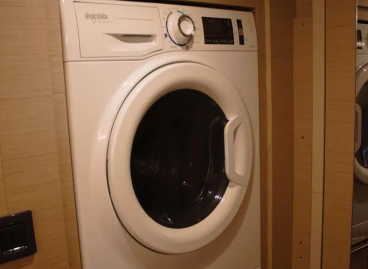 Jungle Goddess Yacht Photos Pics Front-loading washing machine inside Lagoon 46 yacht, 2022 model.
