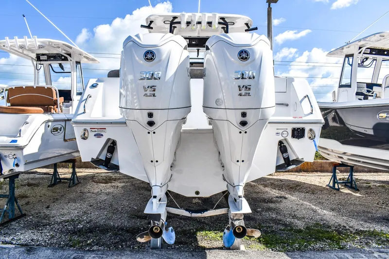  Yacht Photos Pics 2026 Sea Hunt Ultra 285 SE boat with dual Yamaha 300 V6 engines, docked outdoors.