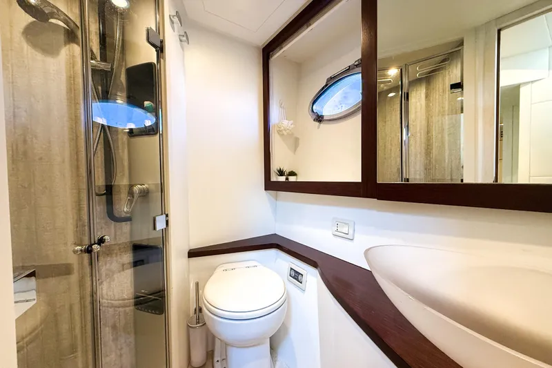  Yacht Photos Pics Luxurious bathroom in a 2006 Pershing 56 yacht, featuring modern fixtures and elegant design.