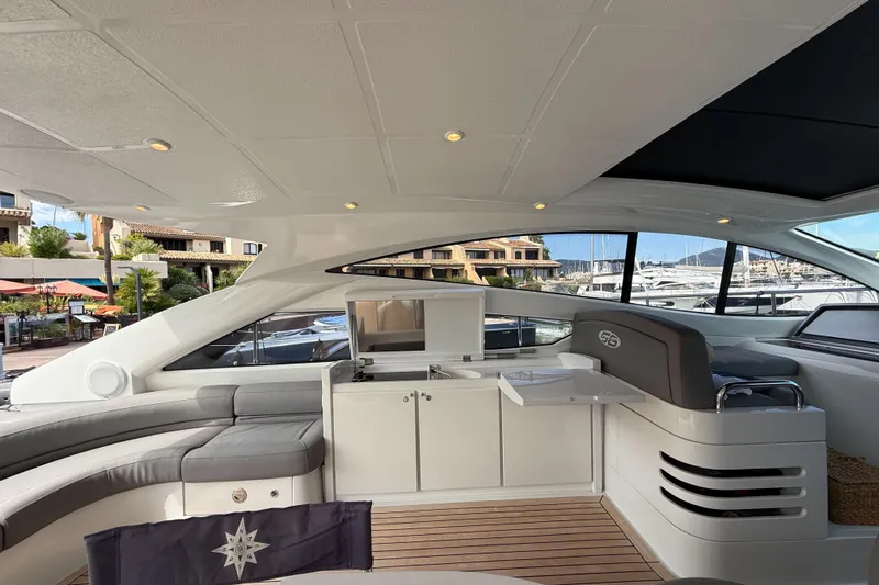  Yacht Photos Pics Luxurious interior of a 2006 Pershing 56 yacht with modern seating and sleek design.