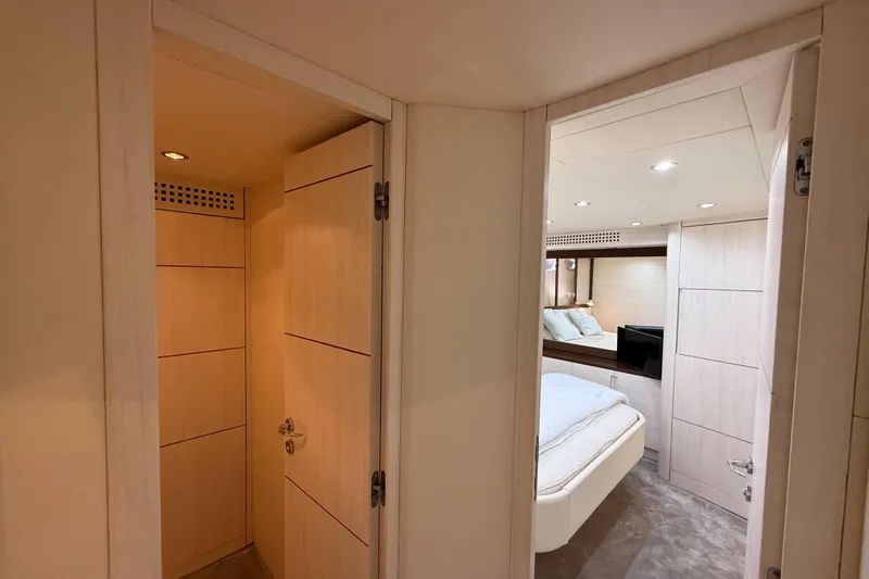  Yacht Photos Pics Interior of 2006 Pershing 56 yacht, featuring a cozy bedroom and modern design.