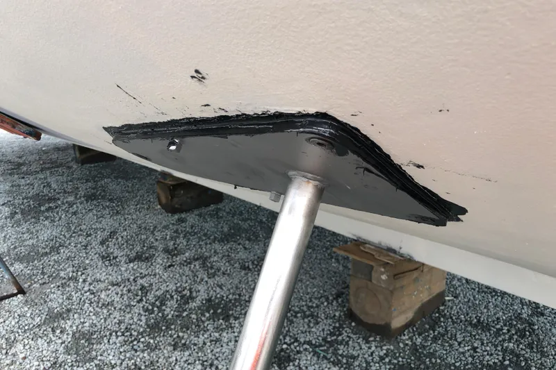 Noelani Yacht Photos Pics 1982 DeFever 52 Offshore Cruiser propeller shaft detail, showing hull attachment and protective coating.