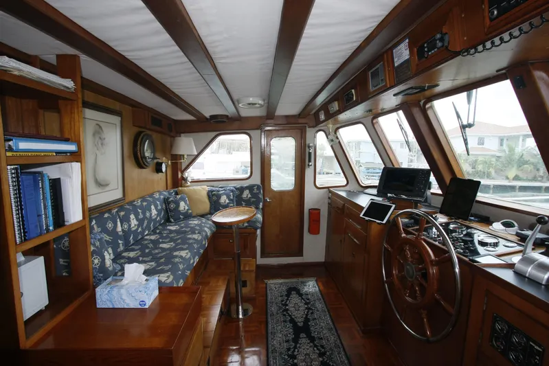 Noelani Yacht Photos Pics Interior of 1982 DeFever 52 Offshore Cruiser with nautical decor and navigation equipment.