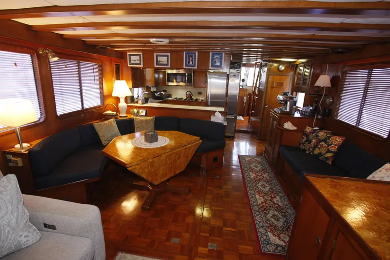 Noelani Yacht Photos Pics Luxurious interior of 1982 DeFever 52 Offshore Cruiser with elegant wood finishes.
