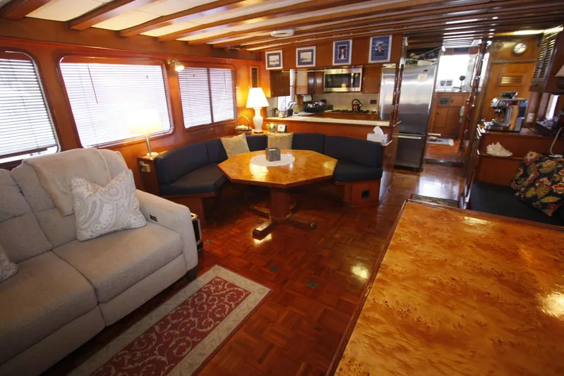 Noelani Yacht Photos Pics Luxurious interior of 1982 DeFever 52 Offshore Cruiser with elegant wood finishes.