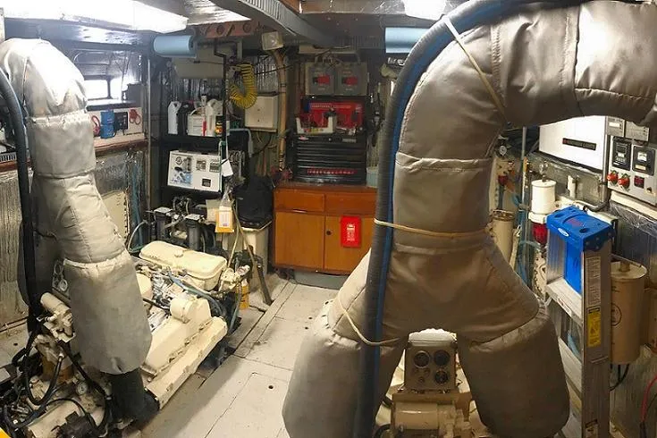 Noelani Yacht Photos Pics Engine room of 1982 DeFever 52 Offshore Cruiser with machinery and equipment.