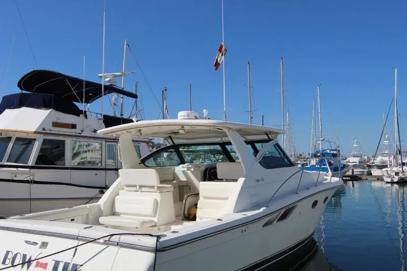  Yacht Photos Pics 2001 Tiara Yachts 3800 Open docked in a marina under clear blue skies.