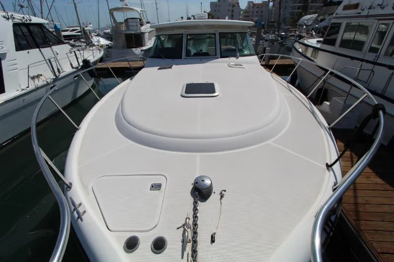  Yacht Photos Pics 2001 Tiara Yachts 3800 Open docked, showcasing sleek design and spacious deck.