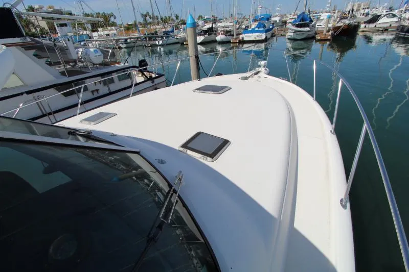  Yacht Photos Pics 2001 Tiara Yachts 3800 Open docked in a marina, showcasing sleek deck design.