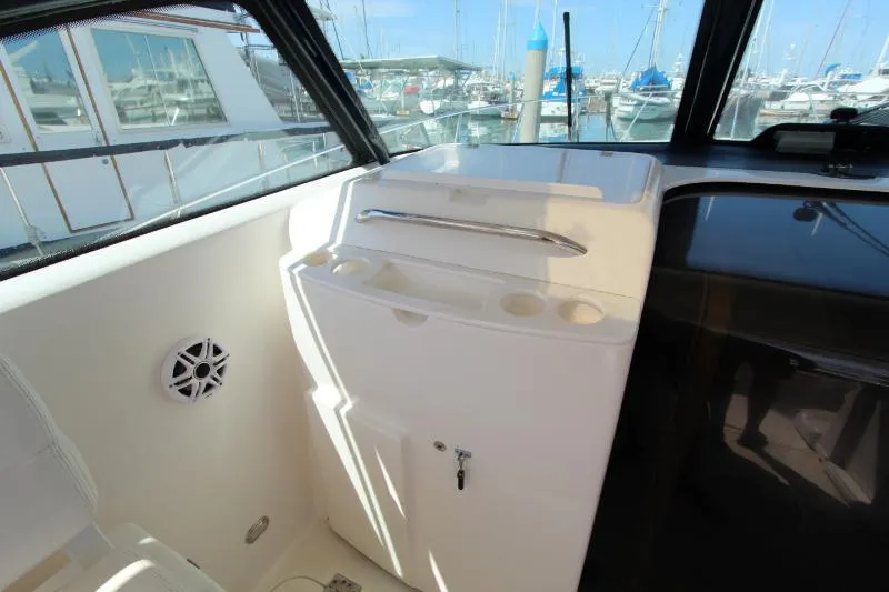 Yacht Photos Pics 2001 Tiara Yachts 3800 Open interior with storage and marina view.