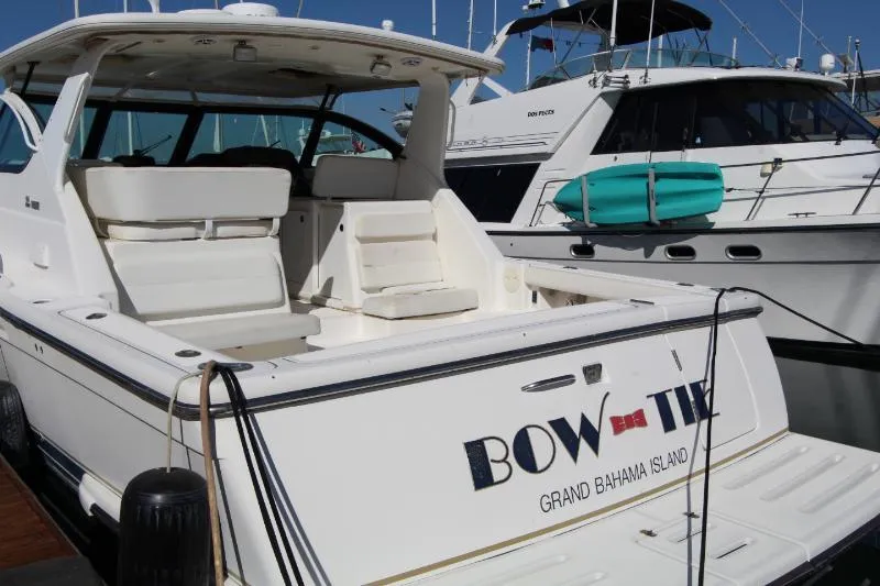  Yacht Photos Pics 2001 Tiara Yachts 3800 Open docked, featuring spacious seating and sleek design.