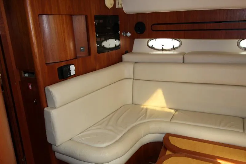  Yacht Photos Pics Interior of 2001 Tiara Yachts 3800 Open with beige seating and wooden accents.