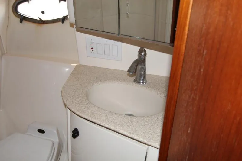  Yacht Photos Pics 2001 Tiara Yachts 3800 Open bathroom with sink, mirror, and toilet.