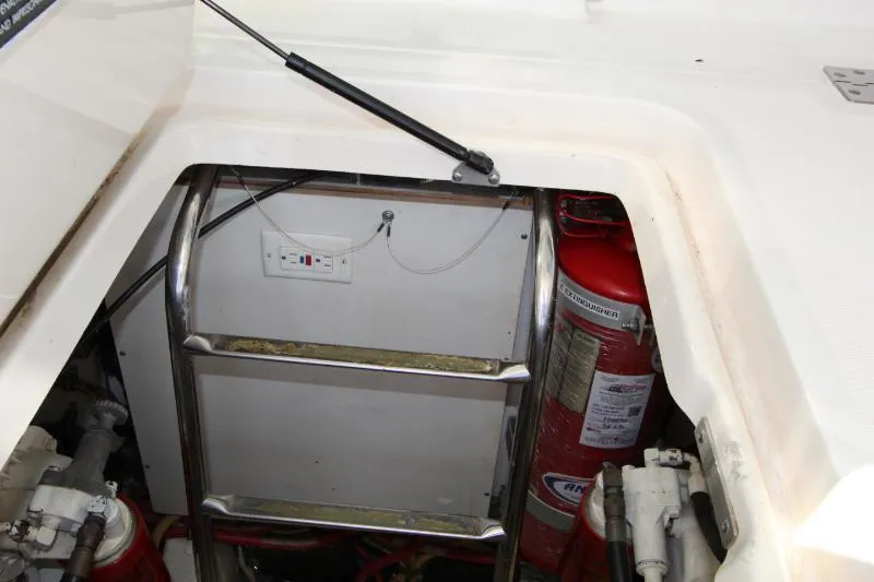  Yacht Photos Pics Engine compartment of 2001 Tiara Yachts 3800 Open with ladder and fire extinguisher.