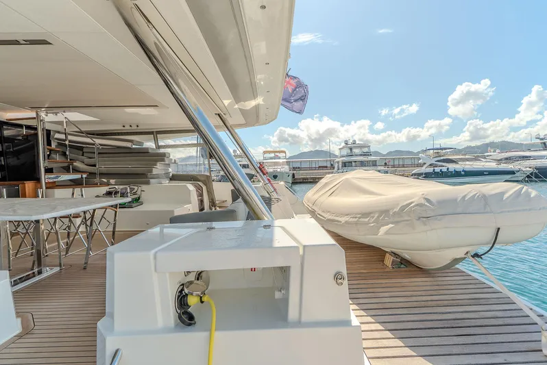  Yacht Photos Pics Luxurious 2022 Fountaine Pajot Samana 59 yacht deck with tender and marina view.