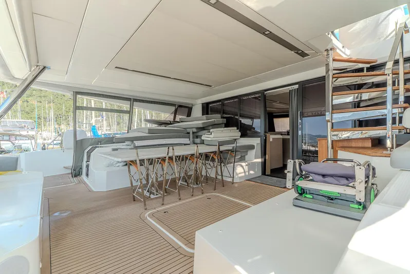  Yacht Photos Pics Luxurious 2022 Fountaine Pajot Samana 59 yacht interior with modern seating and elegant design.