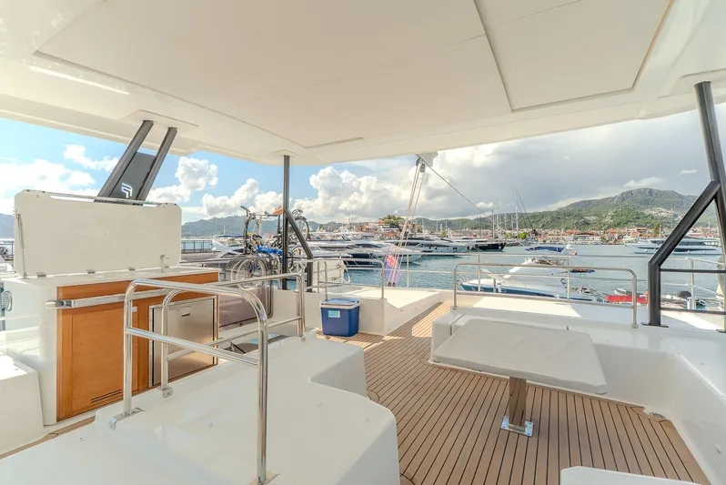  Yacht Photos Pics Luxurious 2022 Fountaine Pajot Samana 59 yacht deck with scenic marina view.