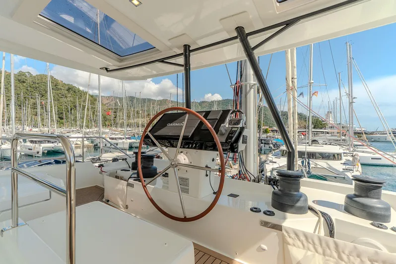  Yacht Photos Pics Helm of 2022 Fountaine Pajot Samana 59 yacht in marina setting.