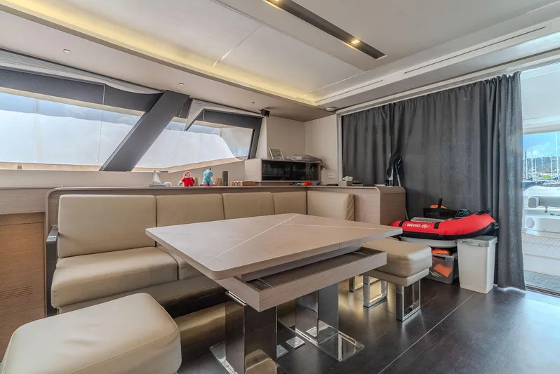  Yacht Photos Pics Luxurious interior of 2022 Fountaine Pajot Samana 59 yacht with modern dining area.