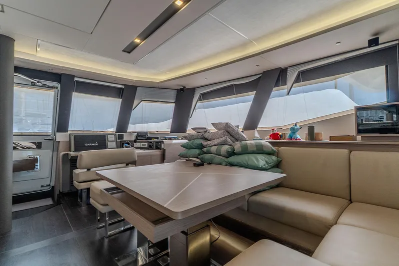  Yacht Photos Pics Luxurious interior of 2022 Fountaine Pajot Samana 59 yacht with modern seating and dining area.