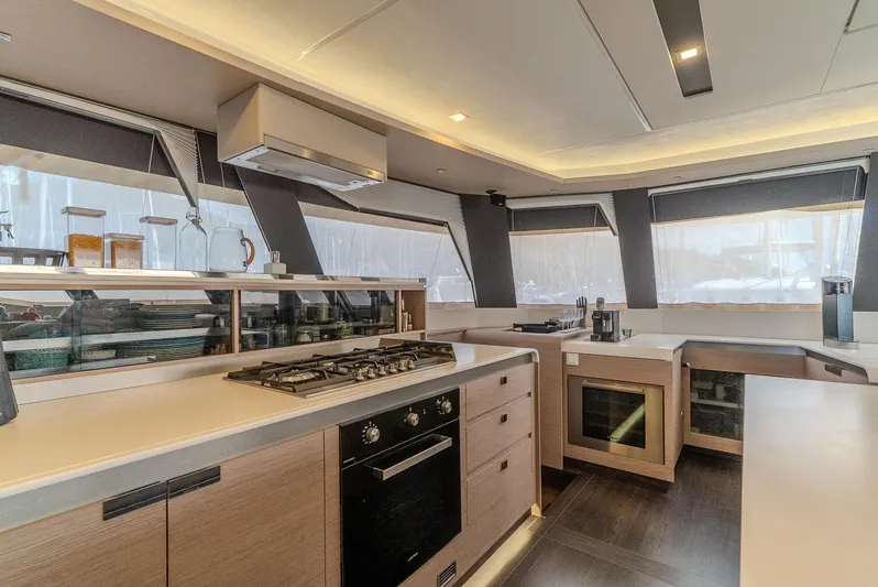  Yacht Photos Pics Modern kitchen interior of 2022 Fountaine Pajot Samana 59 yacht with sleek design.