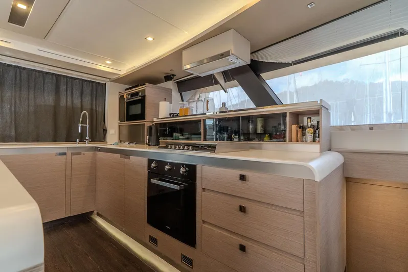  Yacht Photos Pics Modern kitchen interior of 2022 Fountaine Pajot Samana 59 yacht with sleek design.
