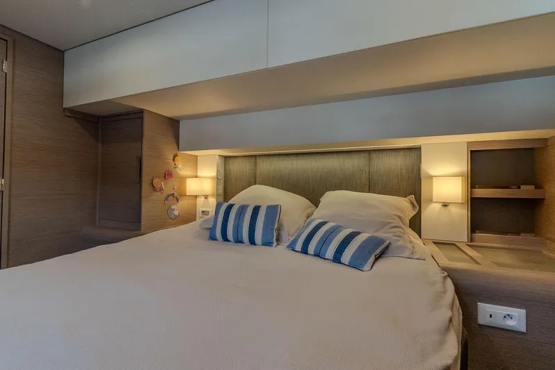  Yacht Photos Pics Luxurious bedroom interior of 2022 Fountaine Pajot Samana 59 yacht with modern design.