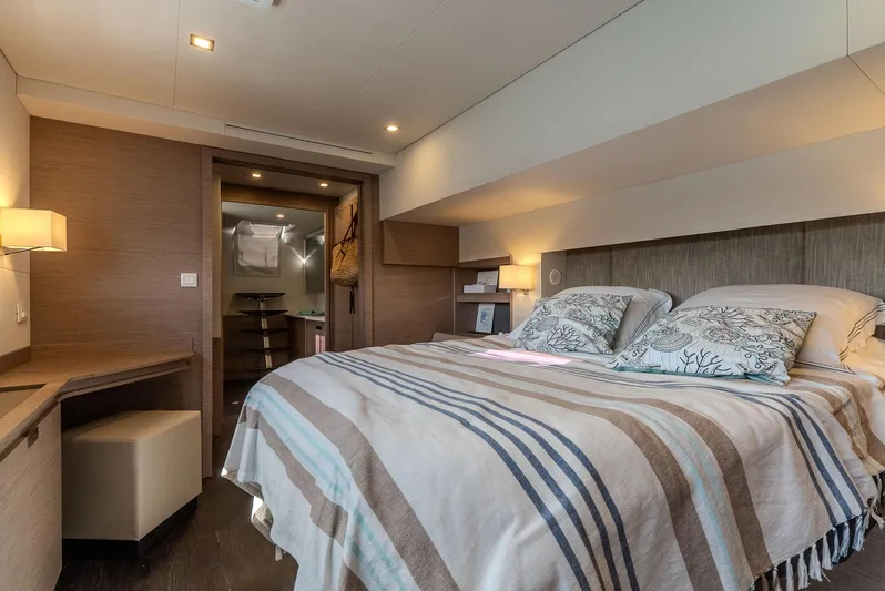  Yacht Photos Pics Luxurious bedroom interior of 2022 Fountaine Pajot Samana 59 yacht with cozy bedding.