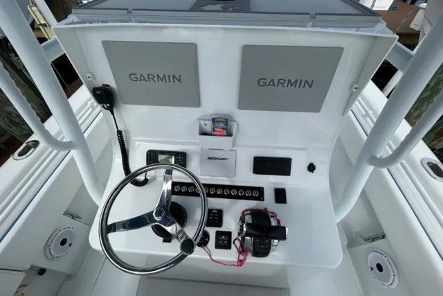  Yacht Photos Pics 2023 Contender 28 Tournament boat dashboard with Garmin displays and Mercury controls.