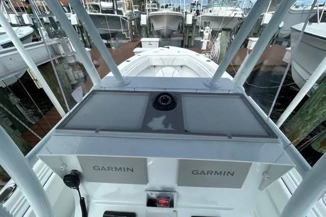  Yacht Photos Pics 2023 Contender 28 Tournament boat with Garmin electronics at a marina dock.