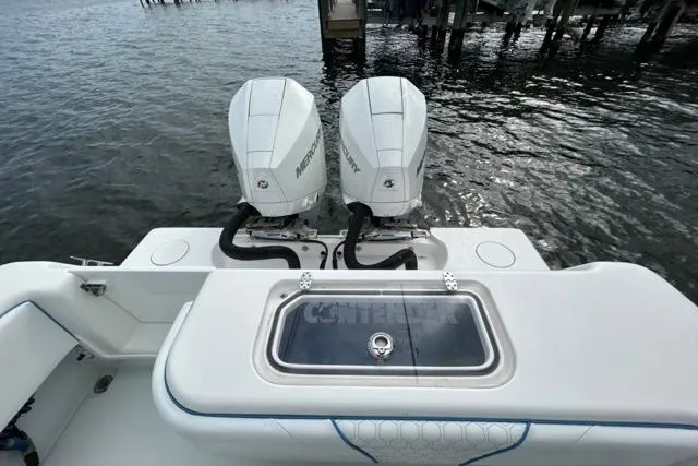  Yacht Photos Pics 2023 Contender 28 Tournament boat with dual Mercury engines on the water.