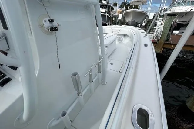  Yacht Photos Pics 2023 Contender 28 Tournament boat, white interior, docked at marina.