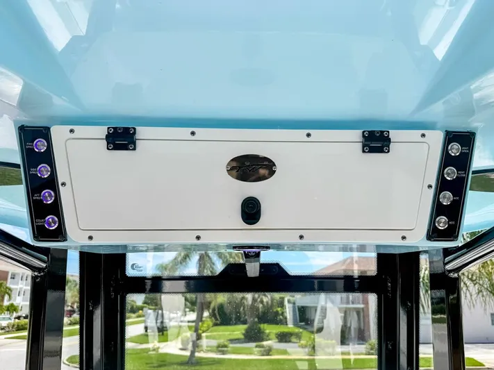  Yacht Photos Pics 2024 Tidewater 256 Adventurer boat console with control panel and switches.