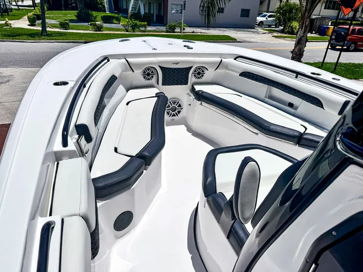  Yacht Photos Pics 2024 Tidewater 256 Adventurer boat interior with sleek seating and modern design.