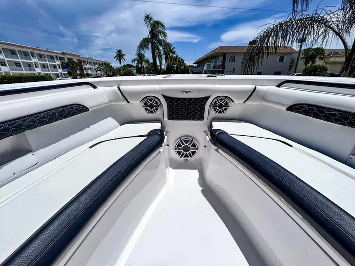  Yacht Photos Pics 2024 Tidewater 256 Adventurer boat interior with sleek seating and modern speakers.