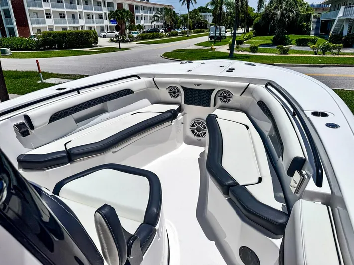  Yacht Photos Pics 2024 Tidewater 256 Adventurer boat interior with luxurious seating and modern design.