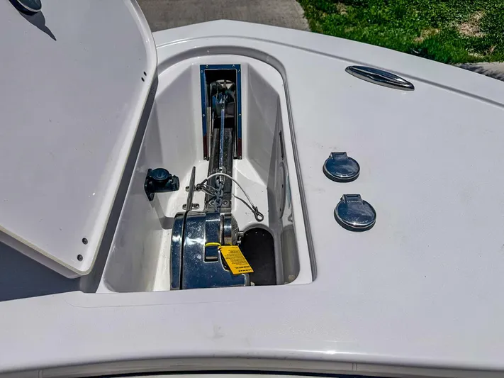  Yacht Photos Pics Open anchor compartment on 2024 Tidewater 256 Adventurer boat, showcasing anchor mechanism.