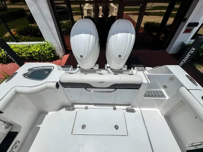  Yacht Photos Pics 2024 Tidewater 256 Adventurer boat with dual engines, sleek white interior, and modern design.