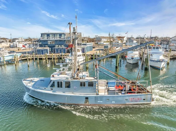  Yacht Photos Pics 2015 Wesmac commercial fishing vessel docked in a marina under clear blue skies.