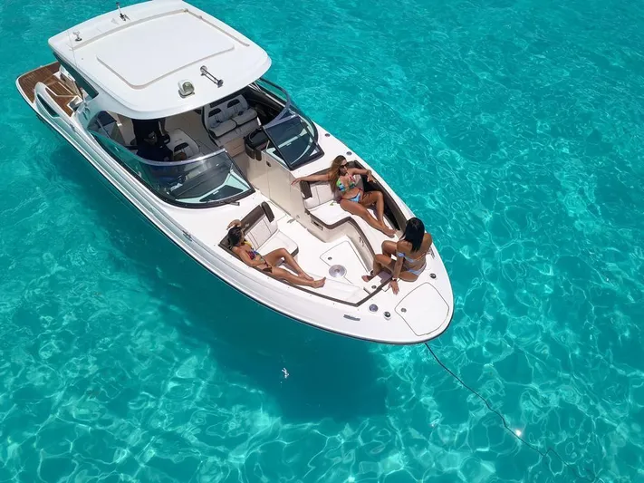  Yacht Photos Pics 2017 Sea Ray 350 SLX boat on clear turquoise water with passengers relaxing.